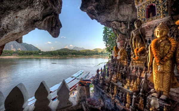 Buddha cave next to Mekong River