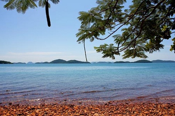  The water surrounding island is so blue and tranquil