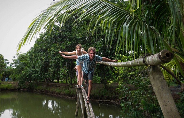 Going on to riverside village to visit orchard, taste honey tea and see coconut candy