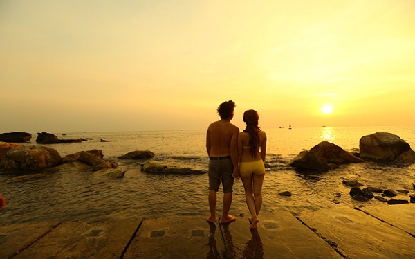 A Newly married honeymoon couple is relaxing on poetic beach, Phu Quoc