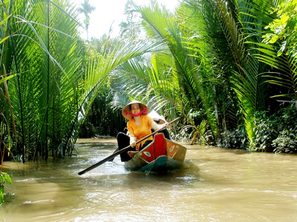 Boating through the lush green vegetation of the canals