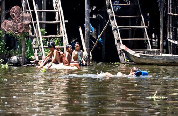 Children swimming on the river