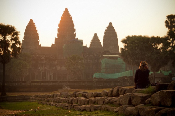 Tourists are watching sunrise at Angkor Wat