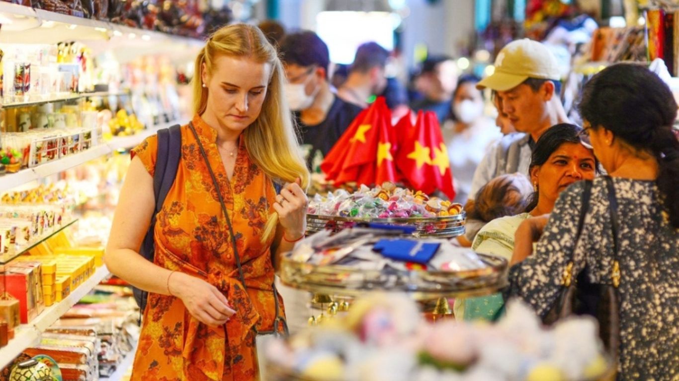 A tourist looking through a shop stall in Ho Chi Minh City