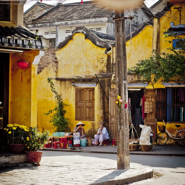 The beauty of Hoian in the April is lightened up with wooden houses on narrow street