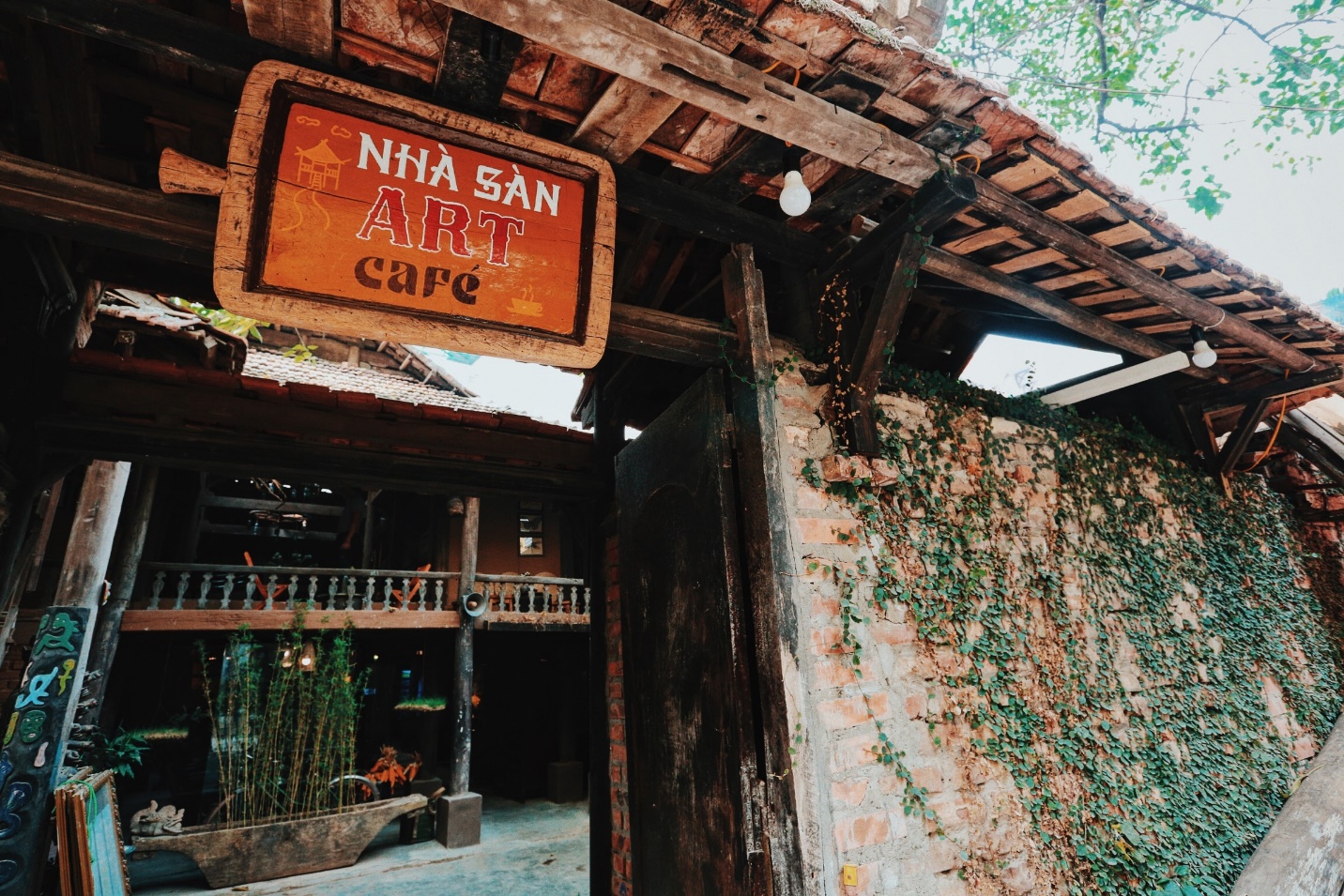 The gate of Nha San Cafe will impress you so much