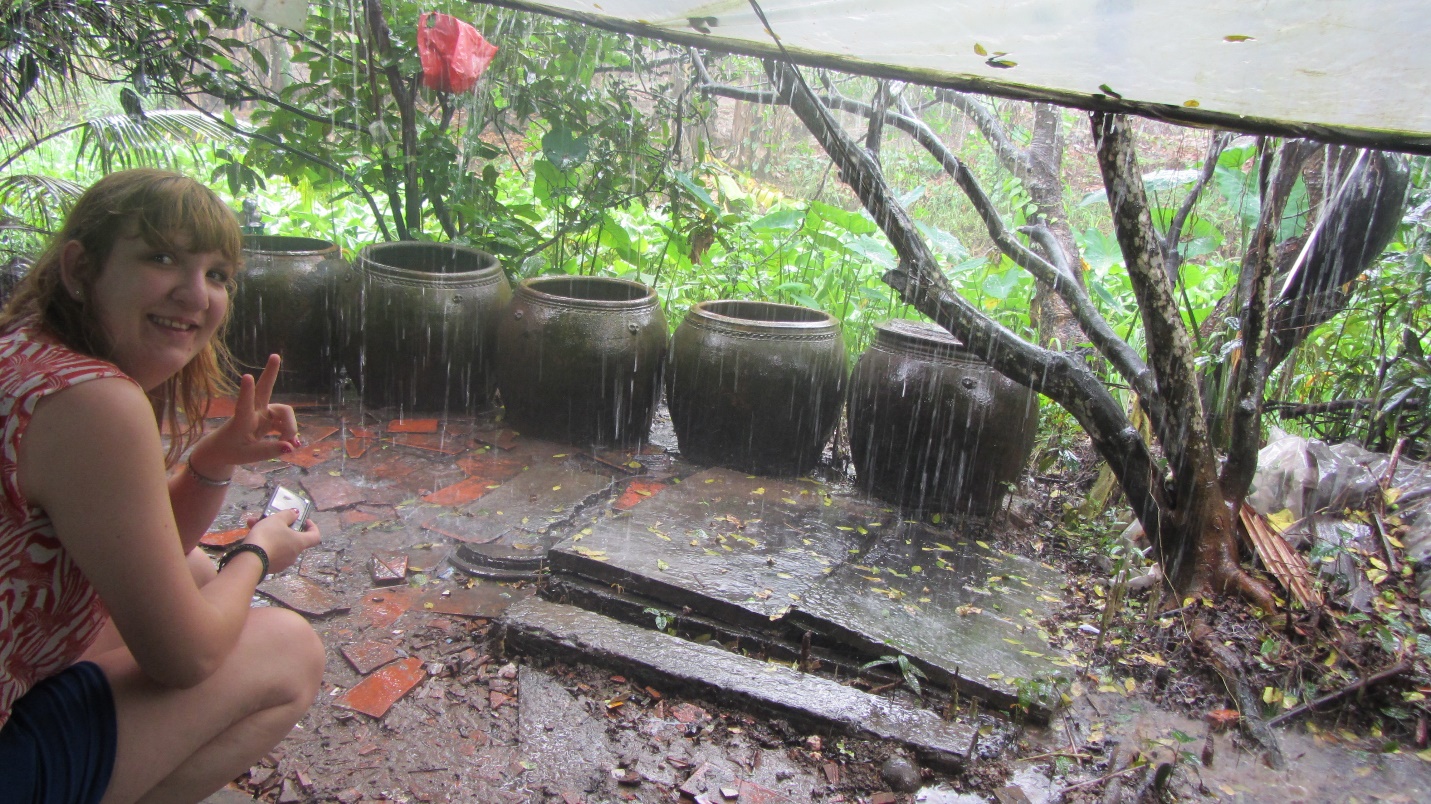 A foreign traveler are sitting and viewing the rain in Mekong Dalta