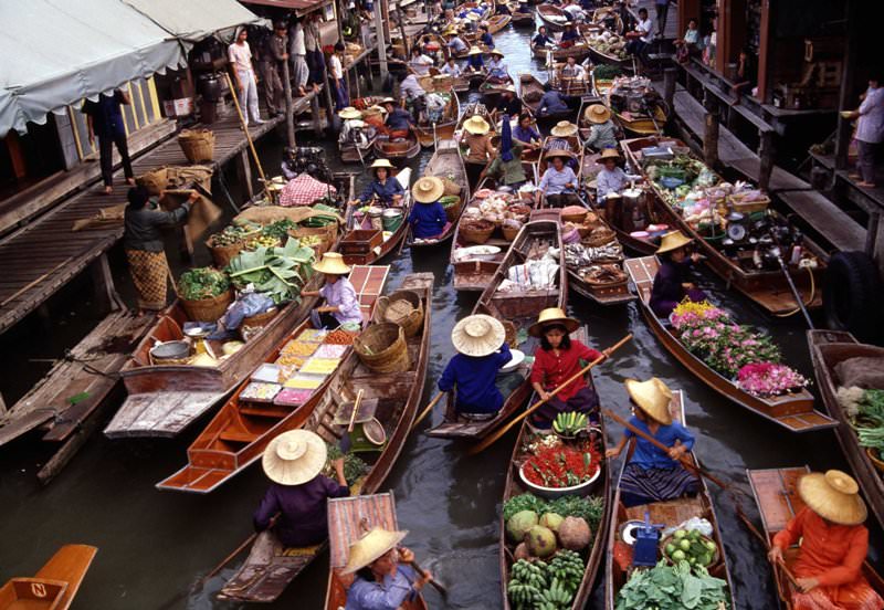 Small canal with full of boats on Damnoen Saduak floating market 
