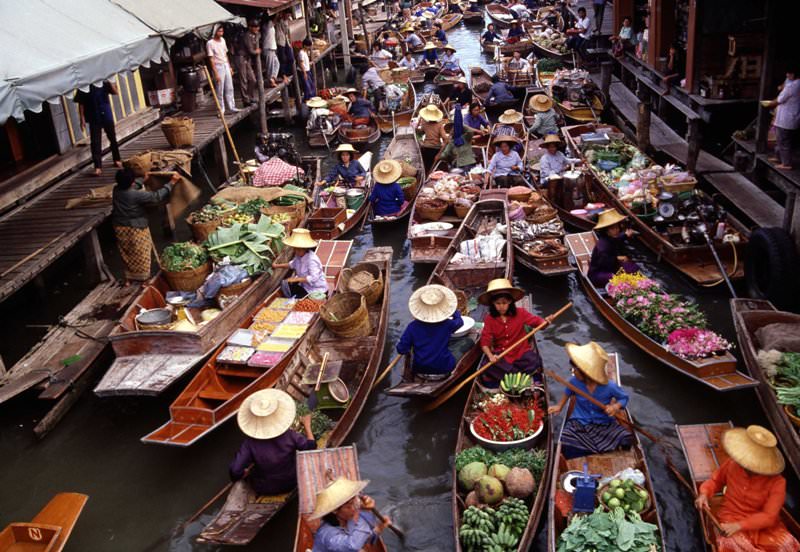 Small canal with full of boats on Damnoen Saduak floating market