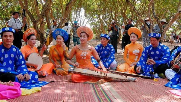 Local people perform traditional music in their fruit farm