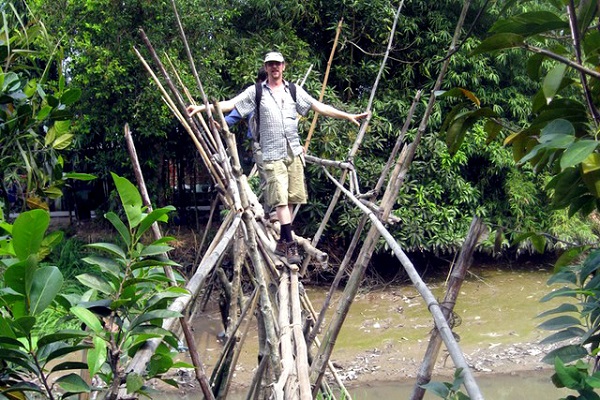Tourists try themselves on the “Monkey Bridge”- a signature of the South of Vietnam on many islets