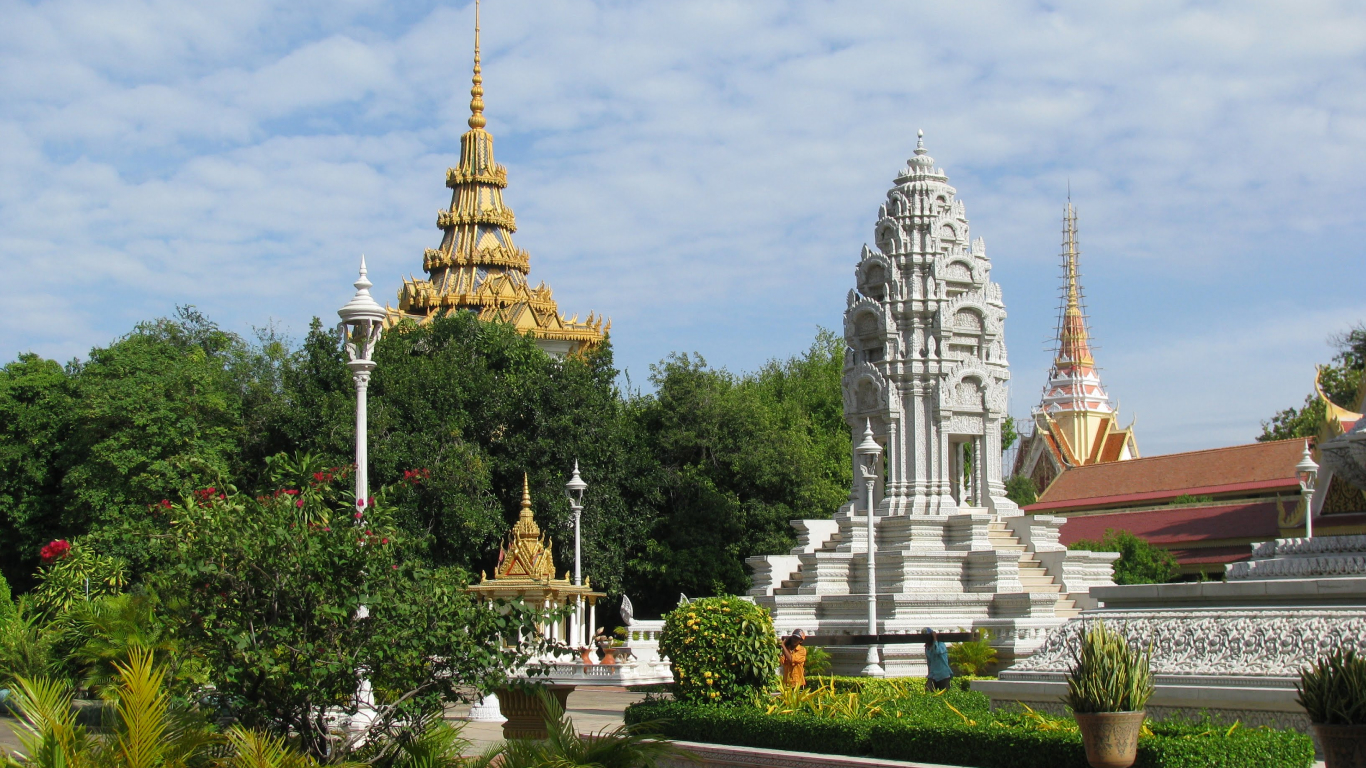 Golden spires and a white stupa at the Royal Palace in Phnom Penh, a Cambodia add-on to the Mekong Delta in November